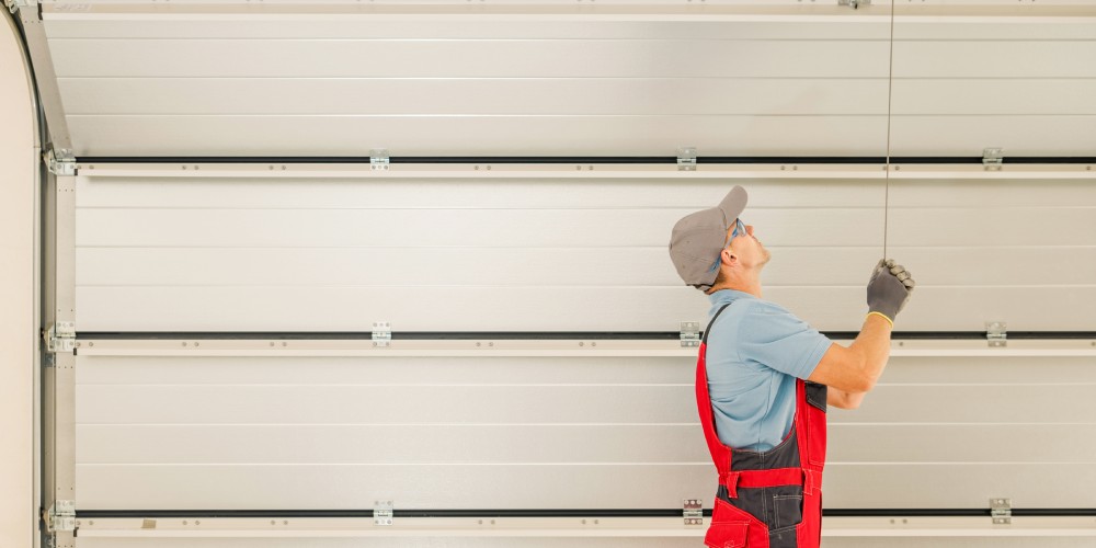 Man adjusting garage door